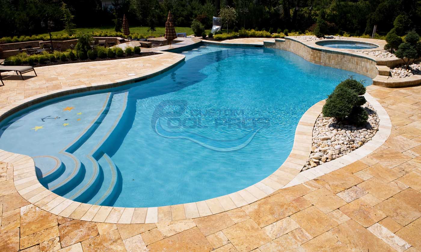 Luxury backyard swimming pool with a curved design, clear blue water, and elegant stone decking, surrounded by lush landscaping and decorative stone features. Ideal for relaxation and outdoor entertainment.