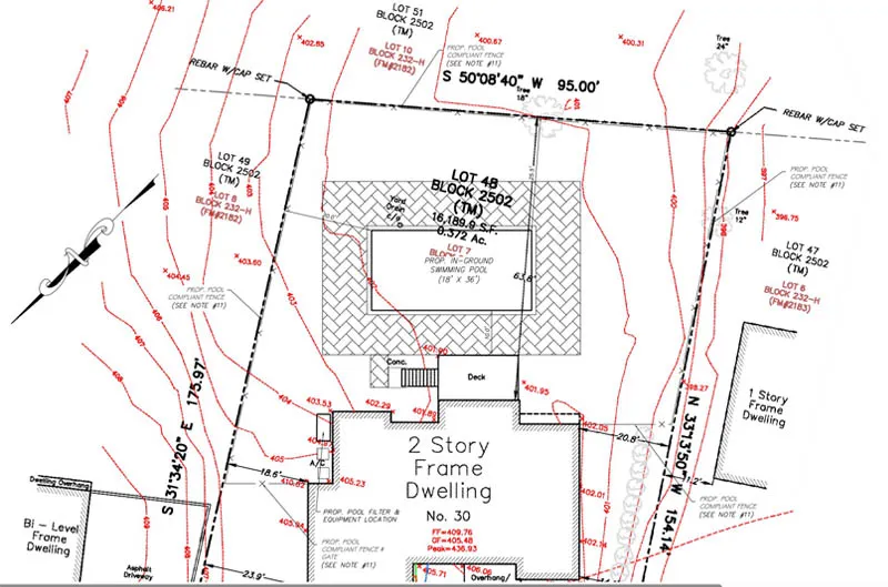 Site plan for a two-story frame dwelling, featuring property boundaries, topographical lines, and construction details.